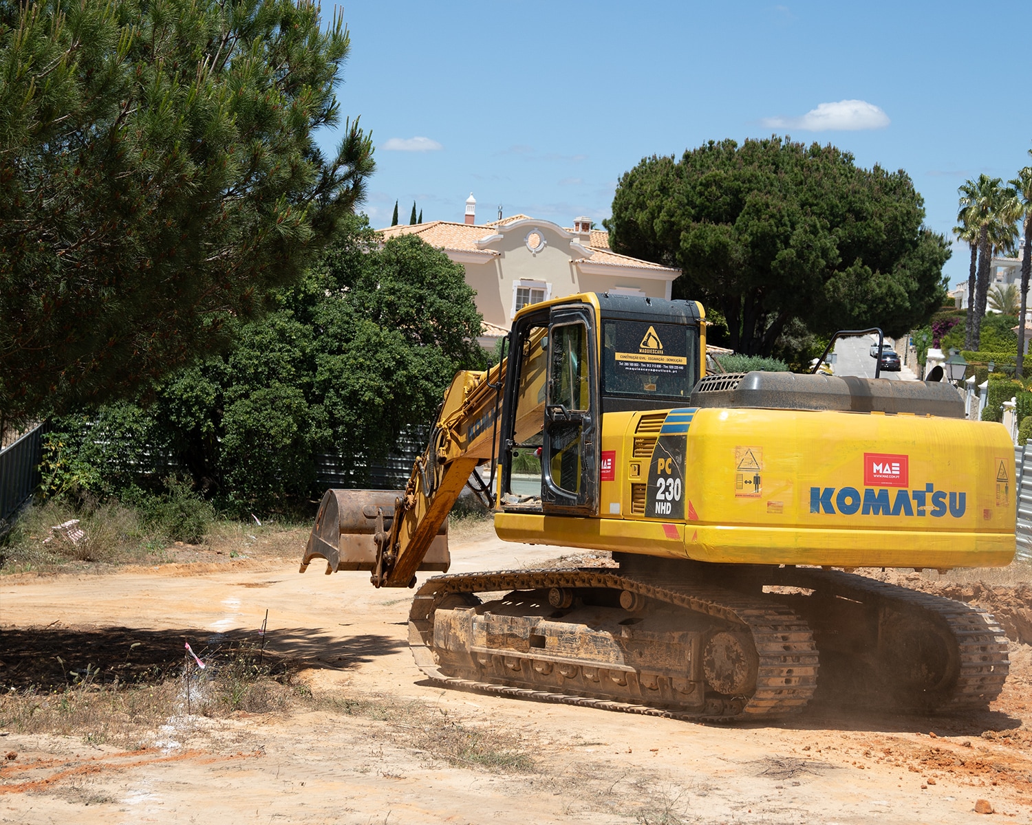 Excavator in operation at the construction site of THE V.